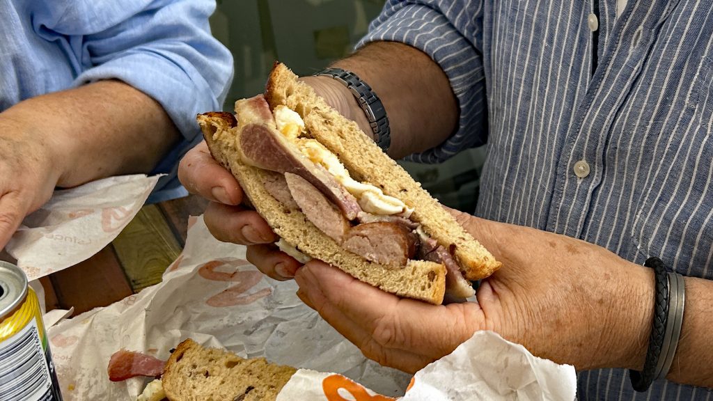 A Wedges Bakery egg, bacon and sausage breakfast sandwich