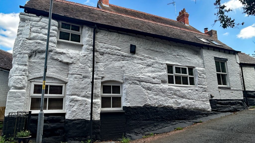 Part brick, part stone house